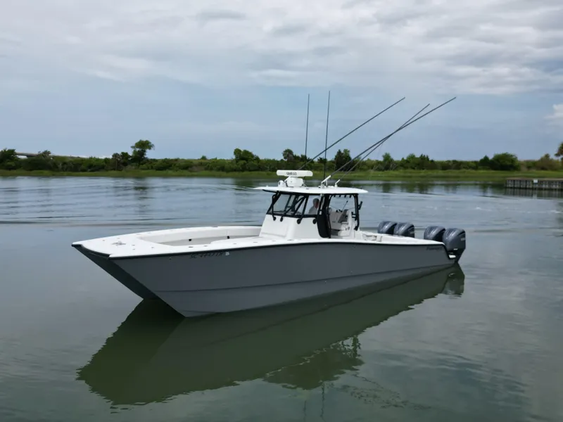 Slide: The Image of 2017 Freeman 37VH boat on calm water with cloudy sky. - 14