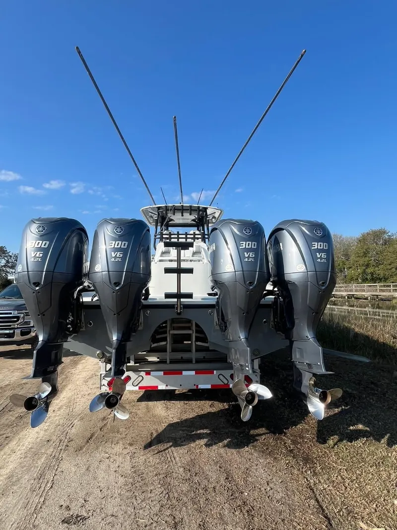 Slide: The Image of A 2017 Freeman 37VH with four powerful outboard engines, mounted on a trailer. - 13