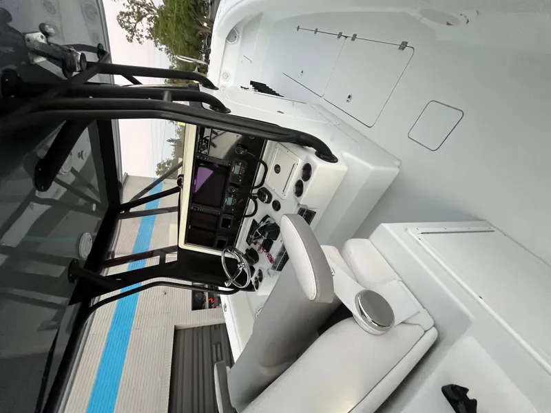 Slide: The Image of The image shows the cockpit of a 2017 Freeman 37VH boat with a modern helm console. - 12