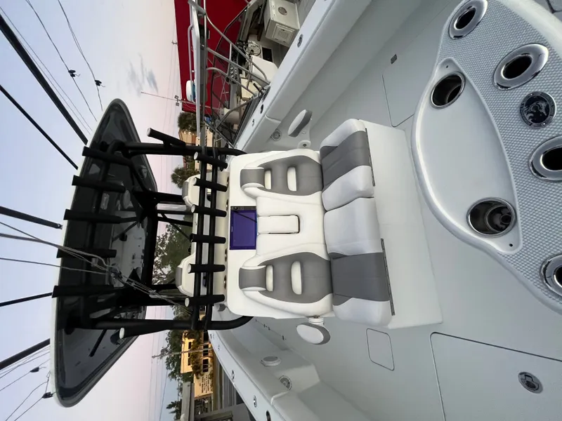 Slide: The Image of The image shows the cockpit of a 2017 Freeman 37VH boat with modern seating and helm console. - 11