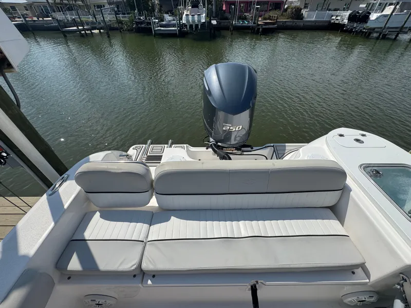 Slide: The Image of Rear view of a 2020 Sea Fox 248 Commander boat by the water. - 20