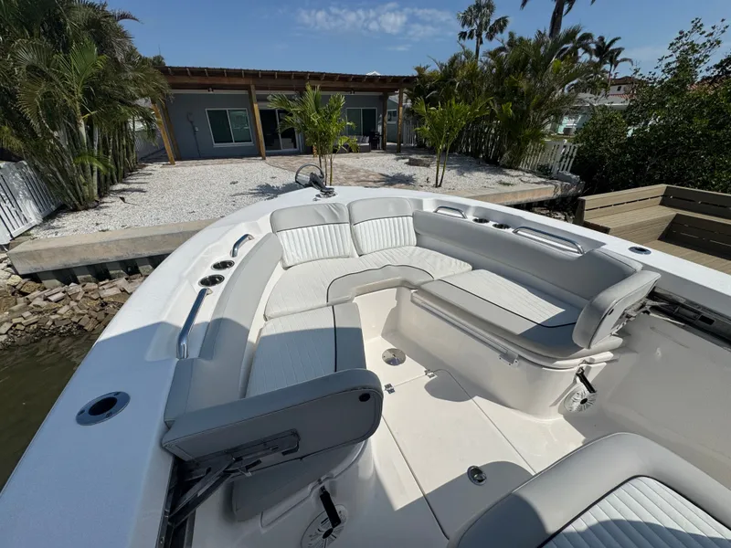Slide: The Image of 2020 Sea Fox 248 Commander boat with luxurious seating area at dock. - 29