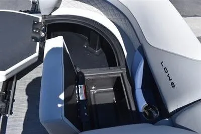 Slide: The Image of 2026 Lowe SF 212 Sport Fish boat interior storage compartment with open lid. - 18