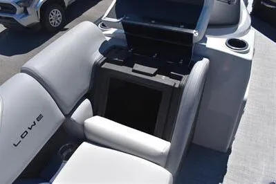Slide: The Image of 2026 Lowe SF 212 Sport Fish boat interior with open storage compartment and seating. - 19