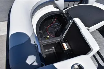 Slide: The Image of 2026 Lowe SF 212 Sport Fish boat storage compartment with open hatch and visible wiring. - 21