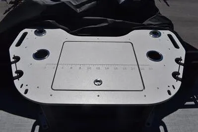 Slide: The Image of Fishing station on 2026 Lowe SF 212 Sport Fish boat with cup holders and measurement guide. - 28