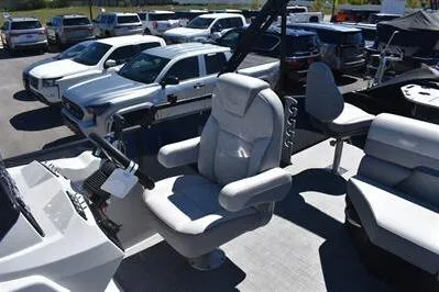 Slide: The Image of 2026 Lowe SF 212 Sport Fish boat interior with captain's chair and steering console. - 30