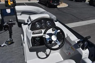 Slide: The Image of 2026 Lowe SF 212 Sport Fish boat interior with steering console and seating. - 31