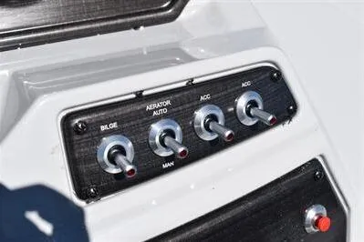 Slide: The Image of Control panel of 2026 Lowe SF 212 Sport Fish boat with toggle switches. - 35