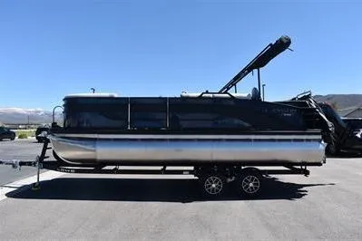 Slide: The Image of 2026 Lowe SF 212 Sport Fish pontoon boat on trailer, parked outdoors. - 7