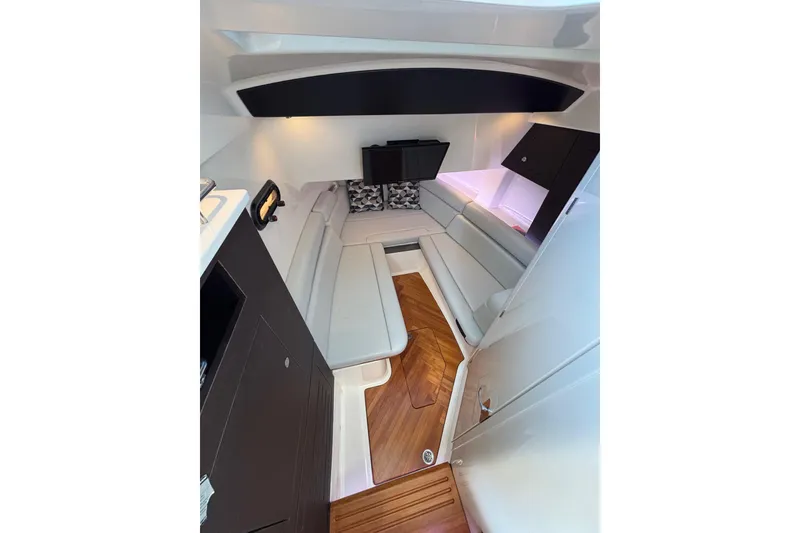 Slide: The Image of Luxurious interior of 2024 Boston Whaler 350 Realm boat with elegant seating and wood flooring. - 33