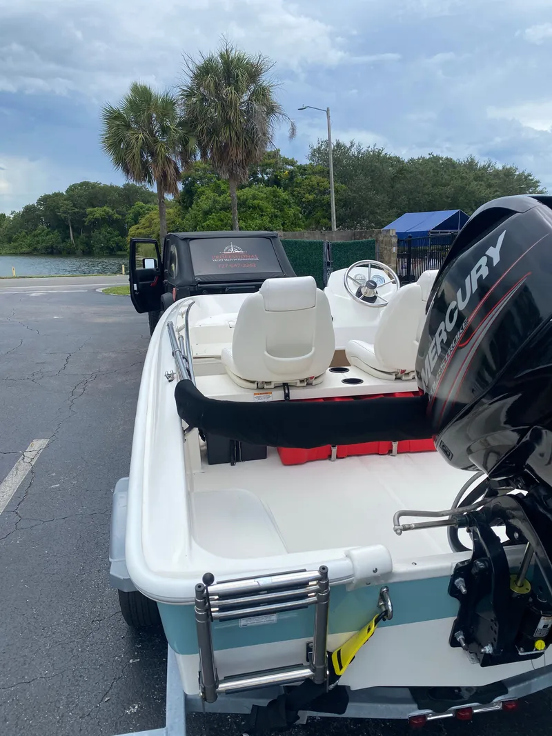 Slide: The Image of 2018 Boston Whaler 150 Super Sport boat with Mercury engine. - 10