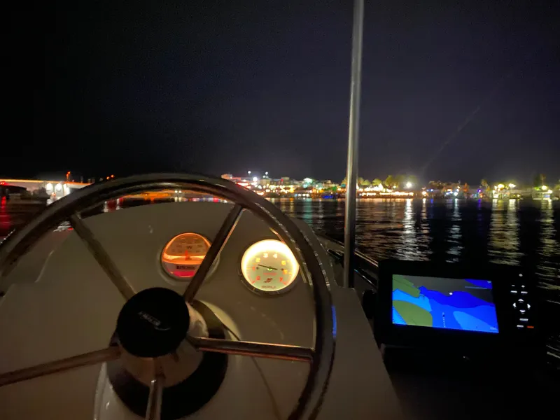 Slide: The Image of Night view from Boston Whaler 150 Super Sport 2018 cockpit. - 17