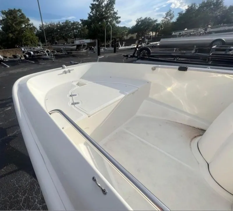 Slide: The Image of The image shows the deck of a 2018 Boston Whaler 150 Super Sport. It is clean and spacious. - 5