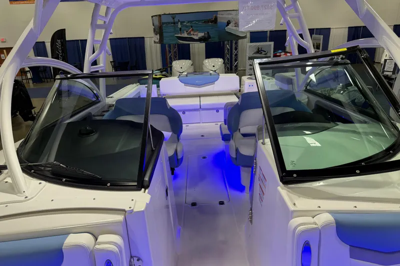 Slide: The Image of 2026 Robalo R317 Dual Console boat interior with blue LED lighting. - 8