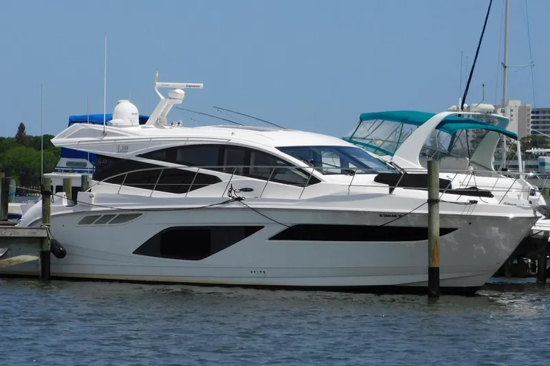 The Image of 2019 Sea Ray L550 yacht docked at marina, featuring sleek design and modern amenities. - 0