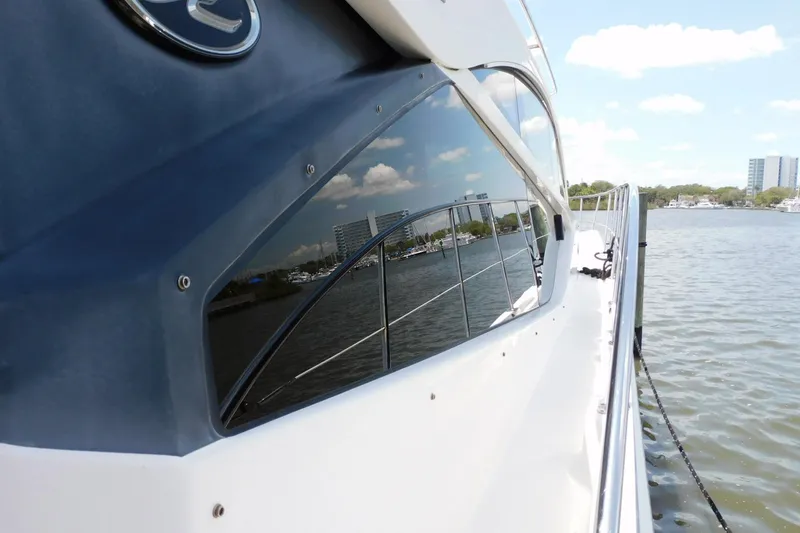 Slide: The Image of 2019 Sea Ray L550 yacht reflecting cityscape on calm water. - 13