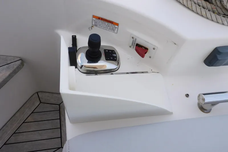 Slide: The Image of Control panel of a 2019 Sea Ray L550 yacht with joystick and warning label. - 14
