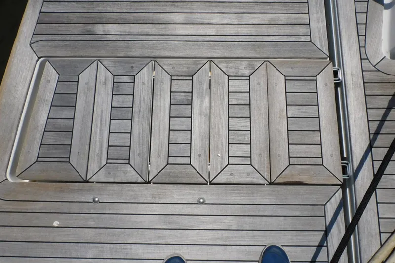Slide: The Image of Teak deck of 2019 Sea Ray L550 yacht, showcasing intricate wood pattern. - 17