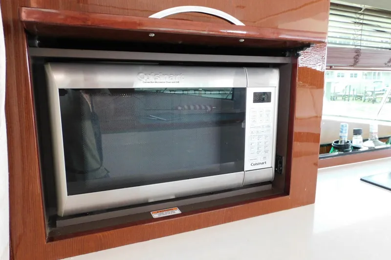 Slide: The Image of Built-in Cuisinart microwave in 2019 Sea Ray L550 yacht kitchen. - 25