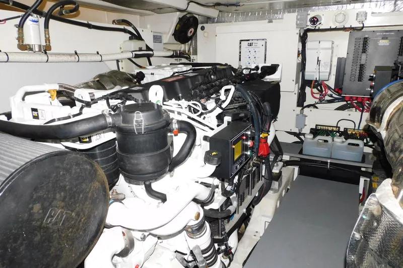 Slide: The Image of Engine room of a 2019 Sea Ray L550 yacht, featuring CAT machinery and electrical systems. - 31