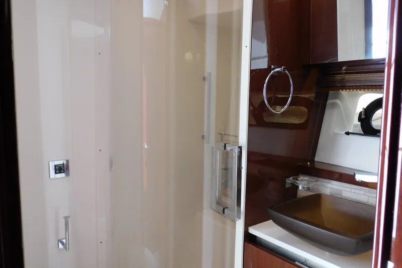 Slide: The Image of Luxurious bathroom interior of 2019 Sea Ray L550 yacht with modern fixtures and elegant design. - 35