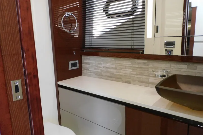 Slide: The Image of Luxurious bathroom interior of 2019 Sea Ray L550 yacht with modern fixtures and elegant design. - 36