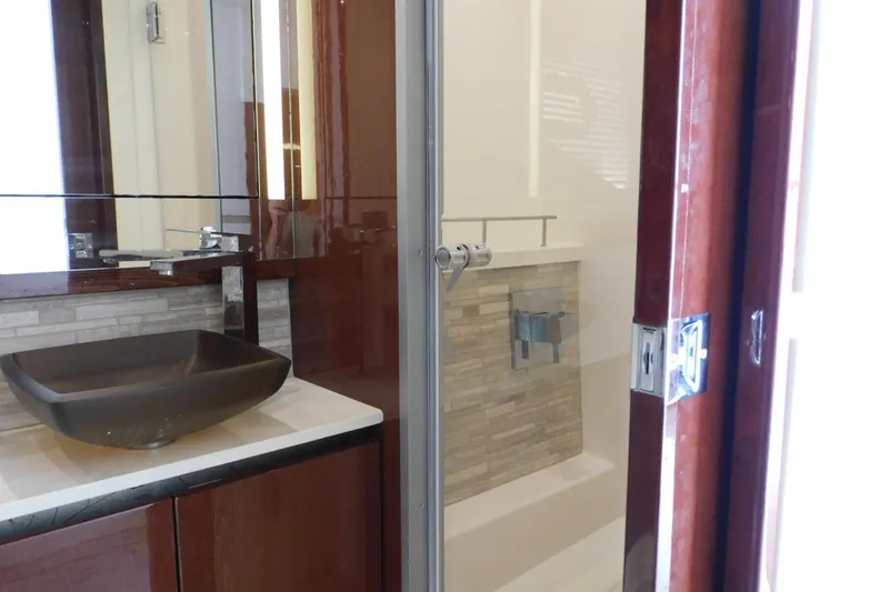 Slide: The Image of Luxurious bathroom interior of 2019 Sea Ray L550 yacht with modern sink and shower. - 37