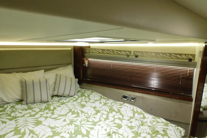 Slide: The Image of Luxurious 2019 Sea Ray L550 yacht bedroom with floral bedding and elegant lighting. - 41