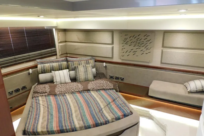 Slide: The Image of Luxurious 2019 Sea Ray L550 yacht bedroom with modern decor and comfortable bedding. - 43