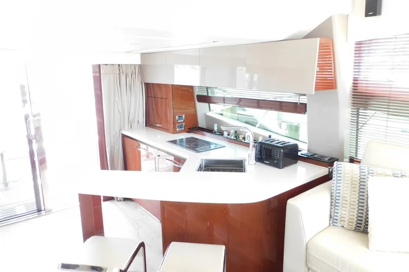 Slide: The Image of Luxurious interior of 2019 Sea Ray L550 yacht featuring modern kitchen design. - 51