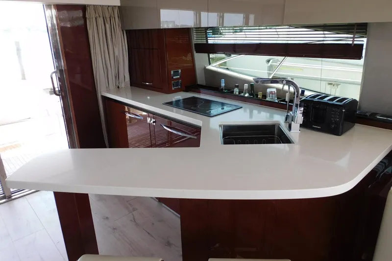 Slide: The Image of Luxurious kitchen interior of 2019 Sea Ray L550 yacht with modern appliances and sleek design. - 56
