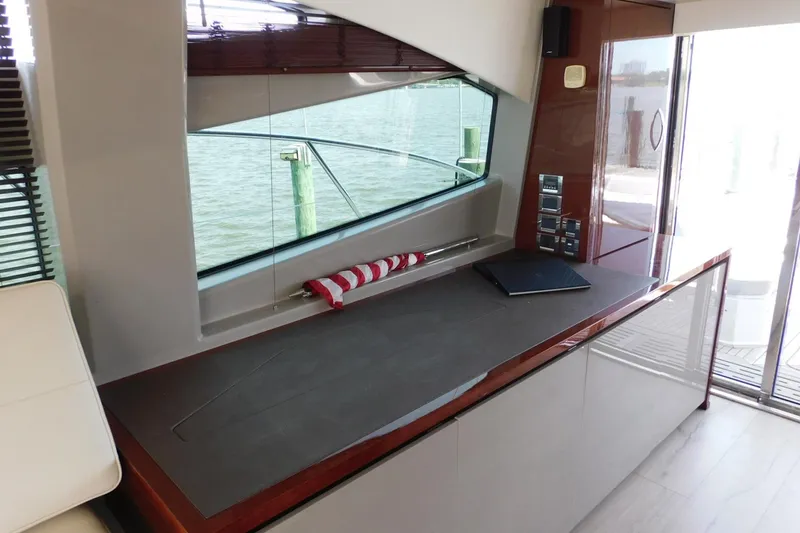 Slide: The Image of Interior of 2019 Sea Ray L550 yacht with sleek design and waterfront view. - 57