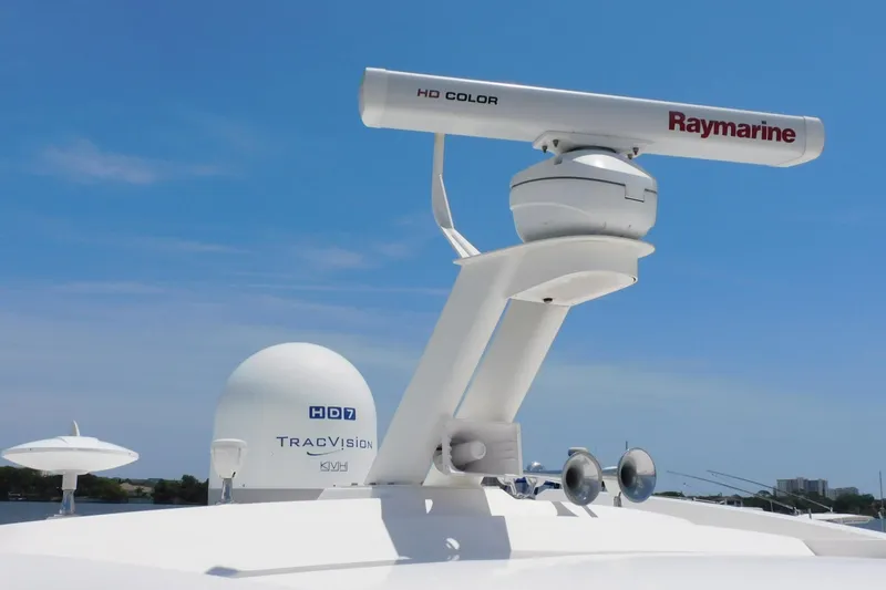 Slide: The Image of Radar and satellite equipment on 2019 Sea Ray L550 yacht under clear blue sky. - 6