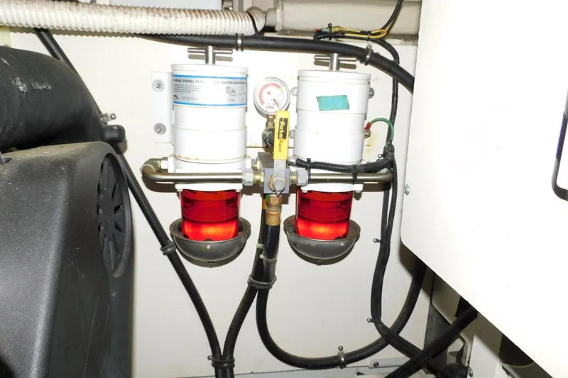 Slide: The Image of Engine room of 2019 Sea Ray L550 with dual fuel filters and gauge. - 62