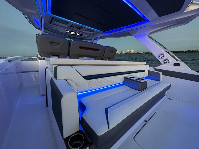 Slide: The Image of Luxurious 2020 Tiara Yachts 43 LS interior with modern seating and ambient blue lighting. - 21