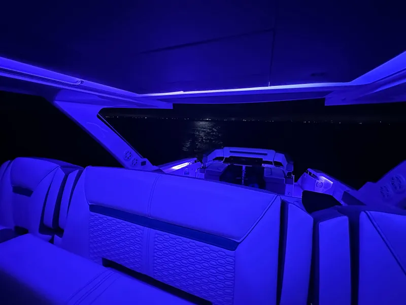 Slide: The Image of 2020 Tiara Yachts 43 LS interior with blue ambient lighting at night. - 41