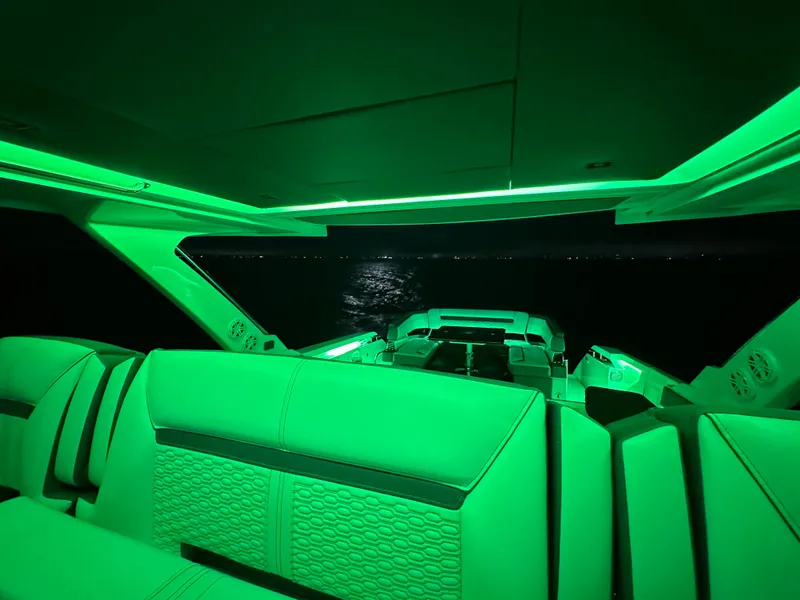 Slide: The Image of 2020 Tiara Yachts 43 LS interior with green ambient lighting at night. - 44