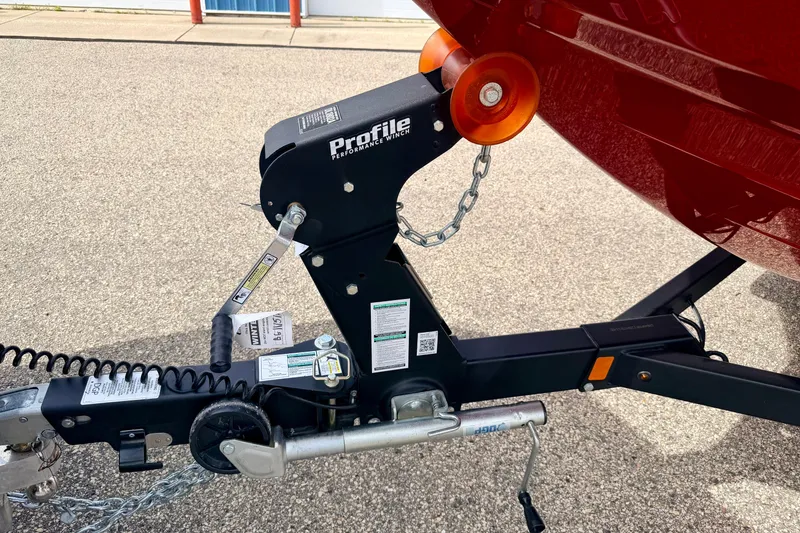 Slide: The Image of Trailer hitch of 2024 Yamaha AR195 boat with Profile winch on pavement. - 10