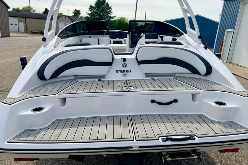 Slide: The Image of 2024 Yamaha AR195 boat rear view with sleek seating and modern design. - 12