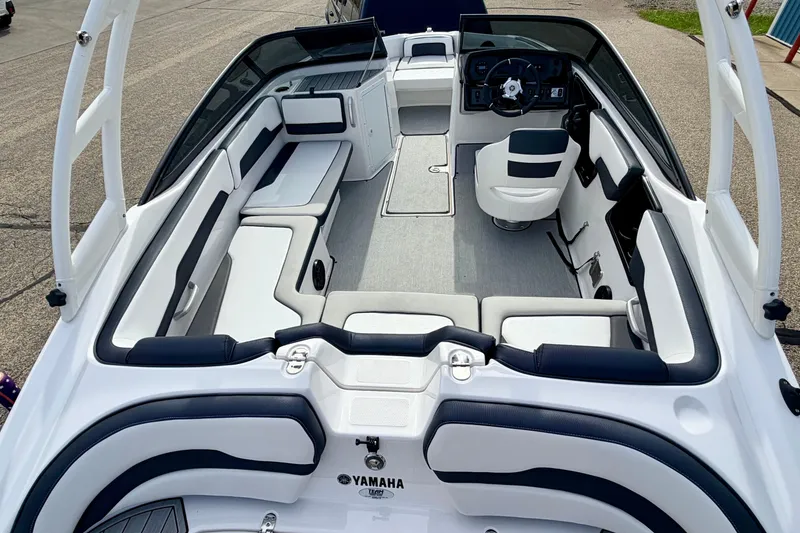 Slide: The Image of 2024 Yamaha AR195 boat interior with sleek seating and modern dashboard design. - 15