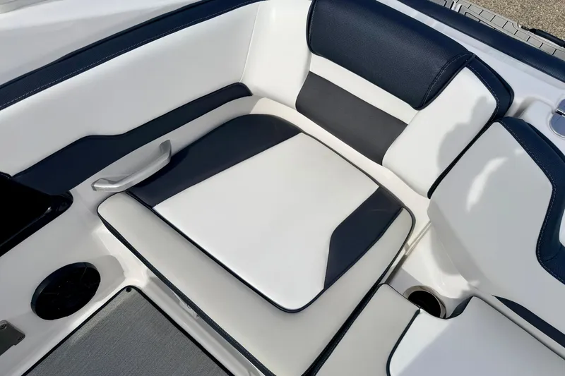 Slide: The Image of 2024 Yamaha AR195 boat interior with sleek white and black seating design. - 22