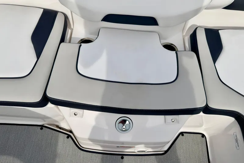 Slide: The Image of 2024 Yamaha AR195 boat seating area with white and navy cushions. - 26