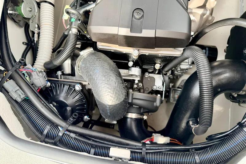 Slide: The Image of 2024 Yamaha AR195 engine compartment showcasing intricate wiring and components. - 30