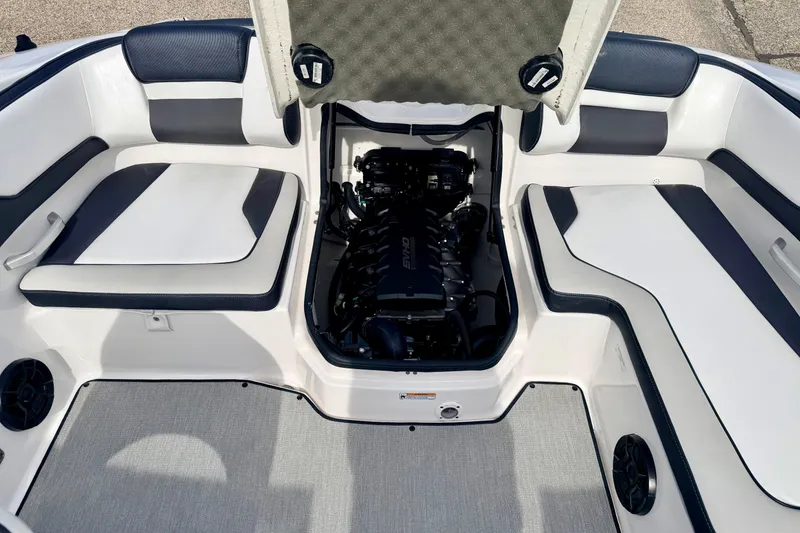 Slide: The Image of 2024 Yamaha AR195 boat interior with open engine compartment, showcasing seating and design. - 31