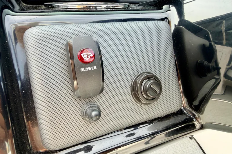 Slide: The Image of Control panel of 2024 Yamaha AR195 boat featuring blower switch. - 36