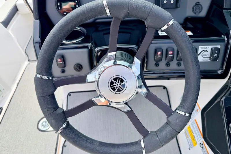 Slide: The Image of Steering wheel of 2024 Yamaha AR195 boat with control panel. - 37