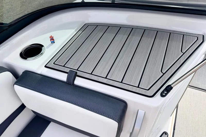 Slide: The Image of 2024 Yamaha AR195 boat interior with sleek seating and cup holder. - 42