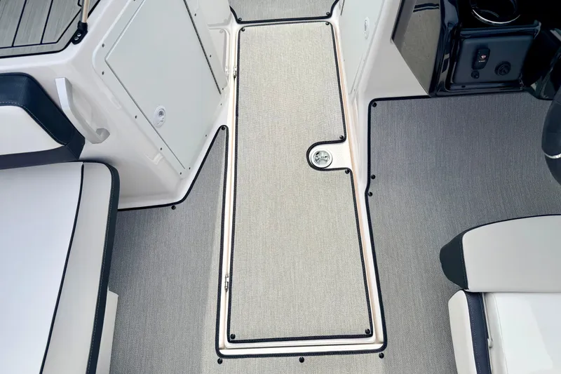 Slide: The Image of 2024 Yamaha AR195 boat interior with sleek flooring and seating. - 47
