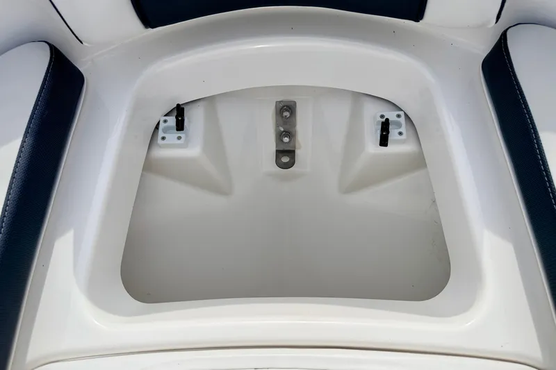 Slide: The Image of Storage compartment of 2024 Yamaha AR195 boat, featuring sleek white interior design. - 54